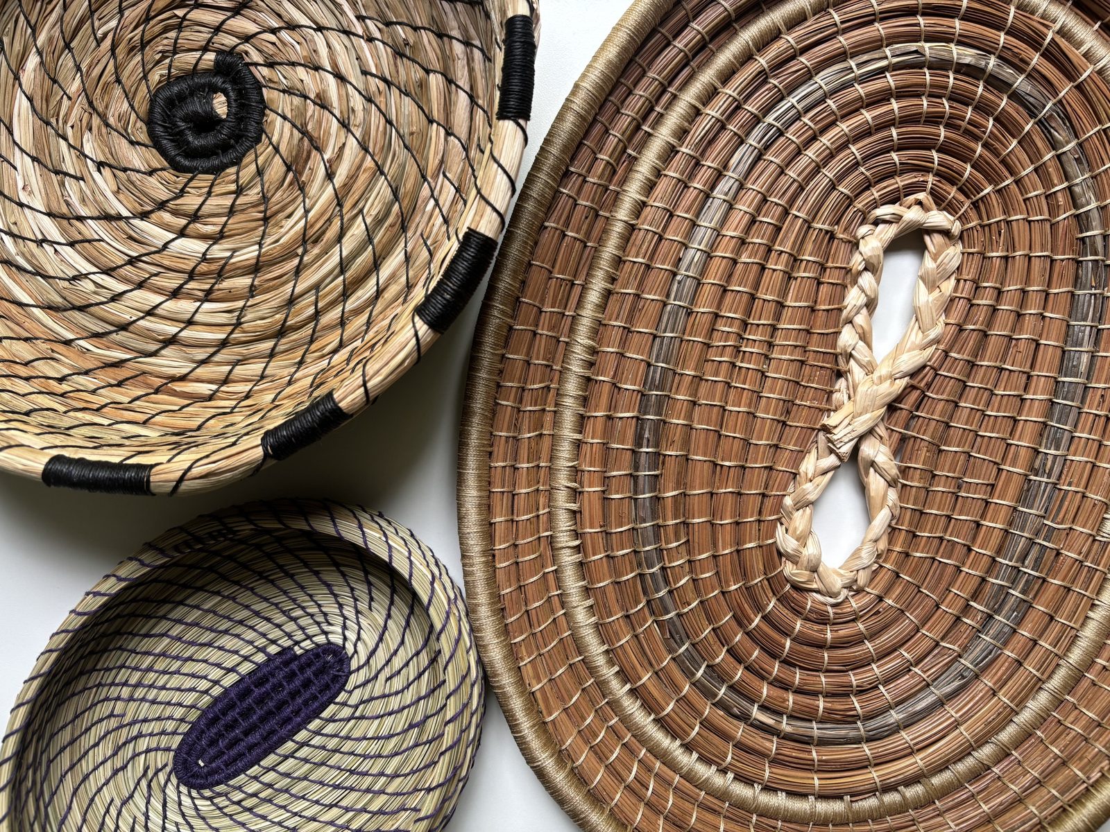 Coiled baskets in a range of materials and techniques.